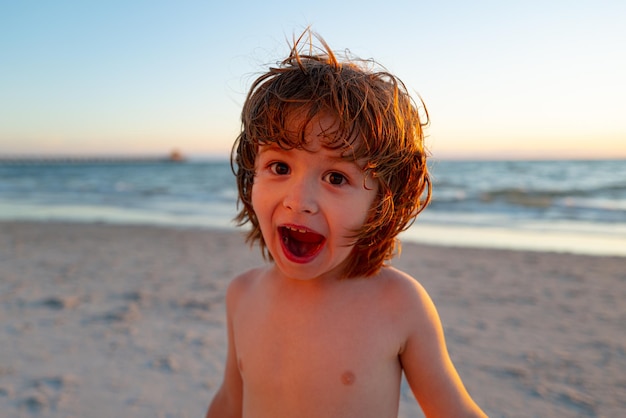 Funny kid at the beach summer vacation concept