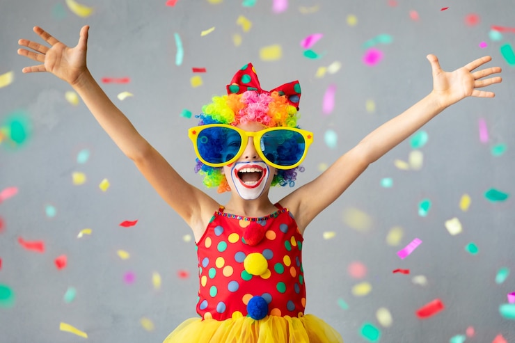 Photo funny kid clown. happy child playing at home. 1 april fool's day concept