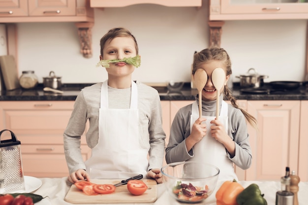 Funny Kids Play Vegetables Have Fun at Kitchen.