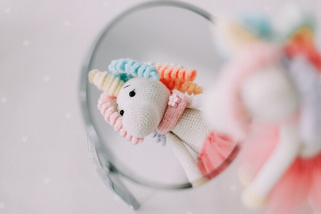 Funny knitted handmade toy unicorn