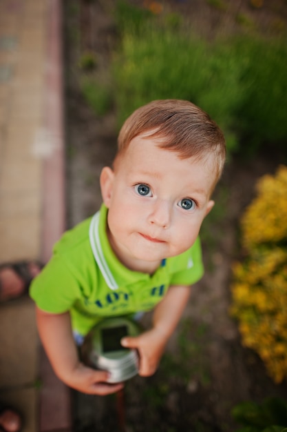 Funny little boy in the courtyard play.