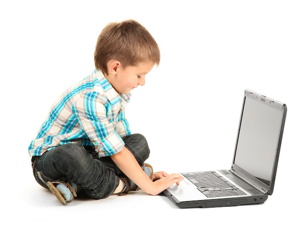 Funny little boy with notebook on white