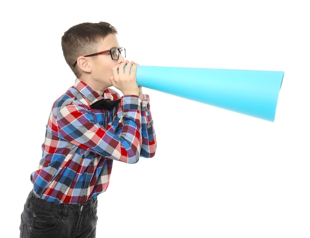 Funny little boy with paper megaphone on white 