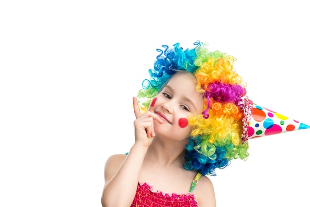 Funny little girl in multicolored wig