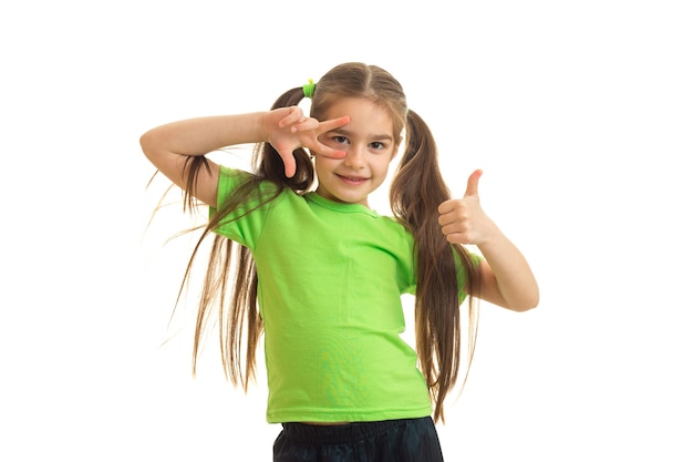 Funny little woman showing thumbs up and smiling isolated on white