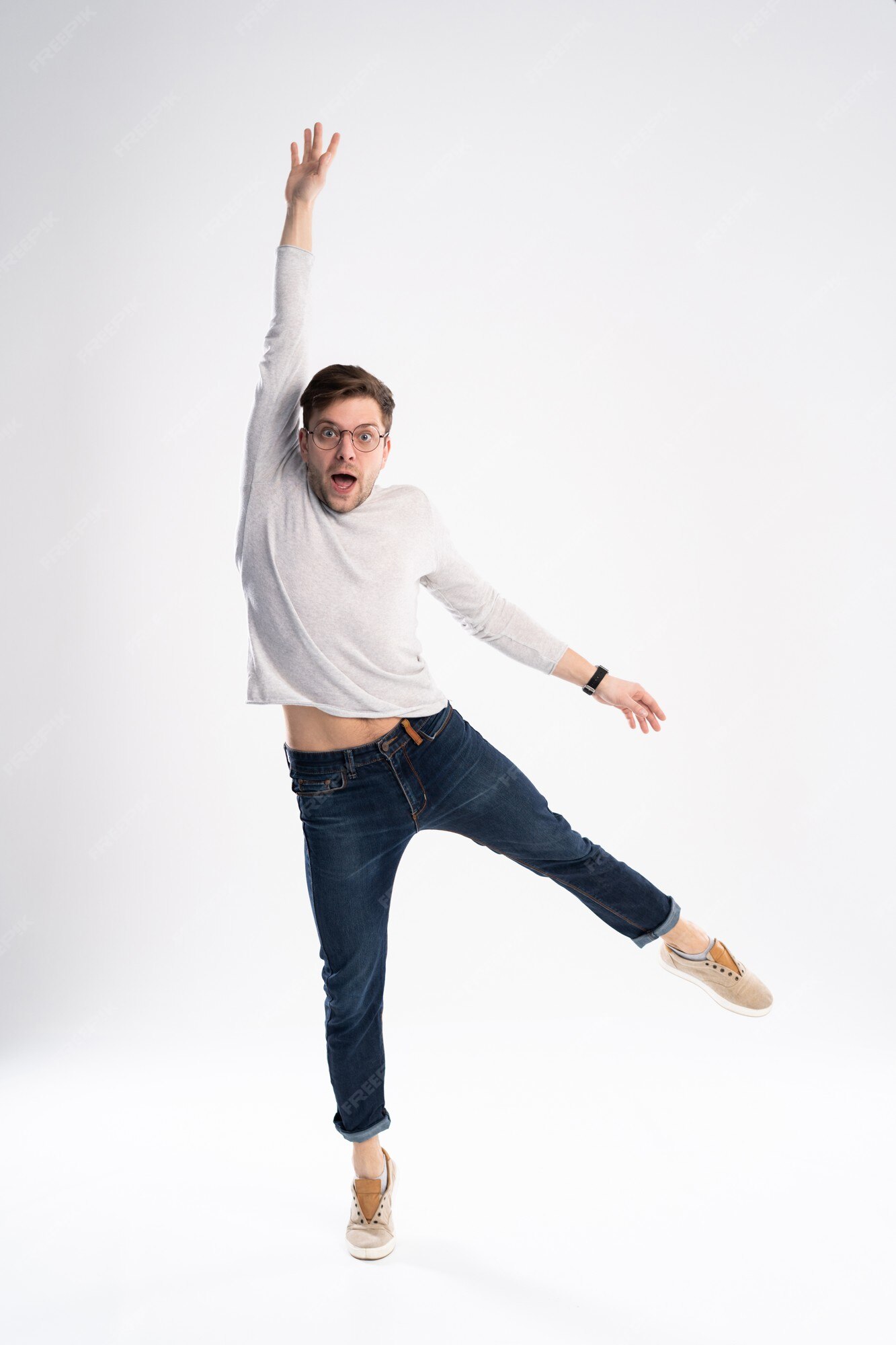 Premium Photo | Funny man in casual t-shirt and jeans jumping isolated over white background. Premium Photo | Funny man in casual t-shirt and jeans jumping isolated over white background.