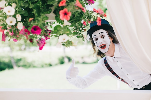 Funny mime with flowers