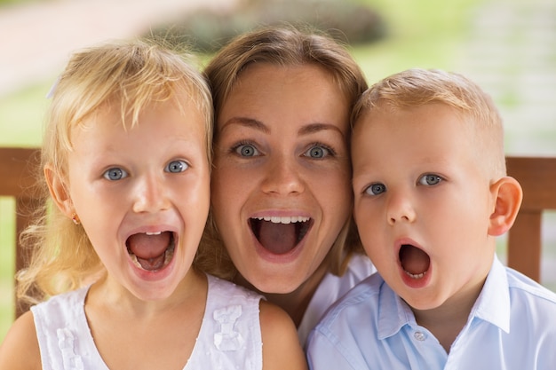 Funny Mother and Children Posing to Camera