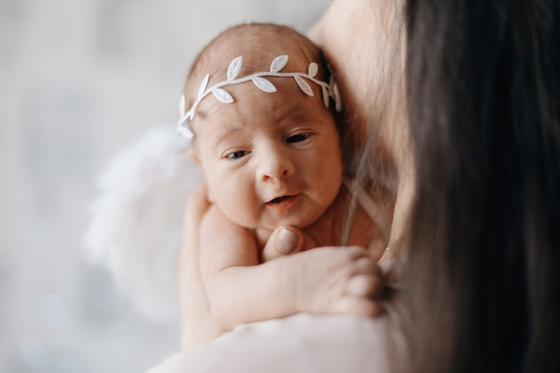 Funny newborn baby with a bandage on his head