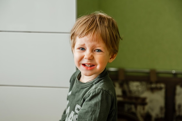 Funny portrait of kid handsome little boy emotion portrait