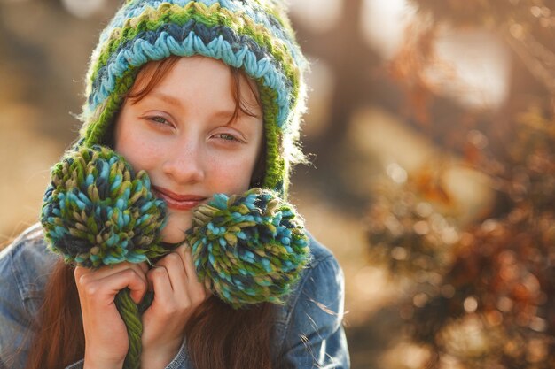 Funny redhaired girl Red haird teenager Cheerful girl on fall background