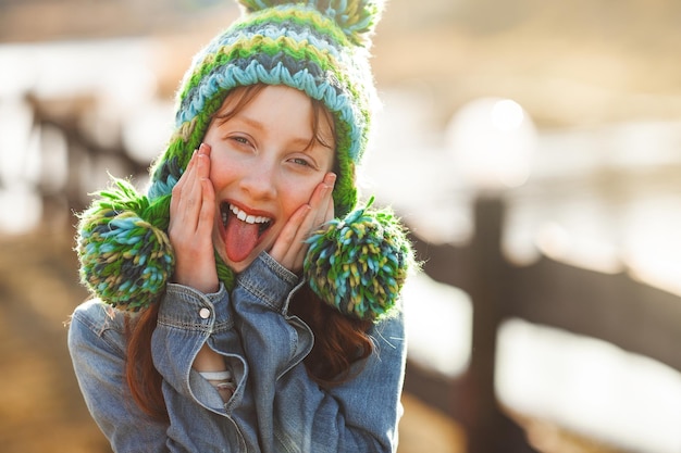 Funny redhaired girl Red haird teenager Cheerful girl on fall background