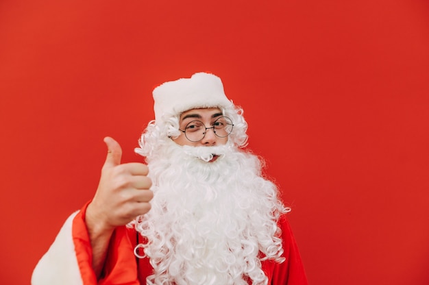 Funny Santa Claus on a red background