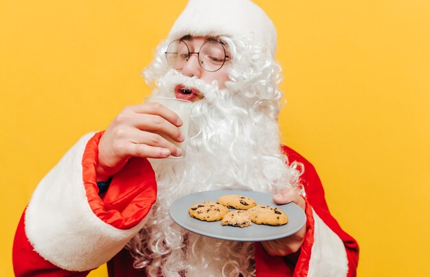 Funny Santa Claus with delicious cookies