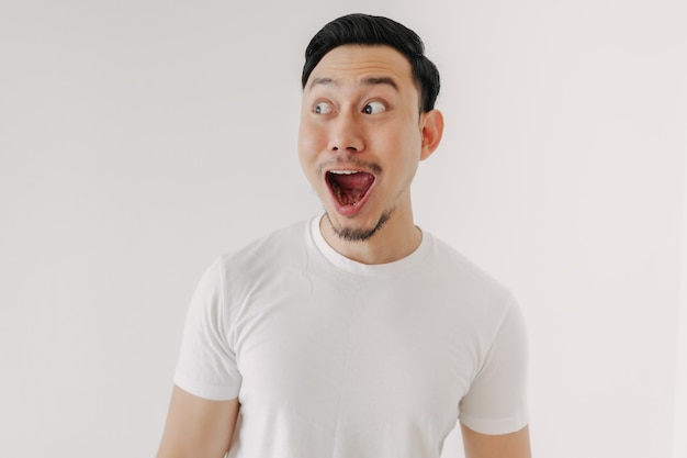 Funny shocked and surprised face of man isolated on white background