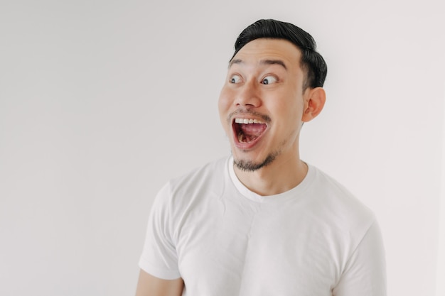 Funny shocked and surprised face of man isolated on white background