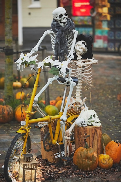 Photo funny skeletons on a bicycle on halloween in denmark