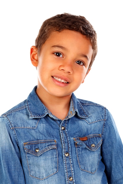 Funny small child with dark hair and black eyes crossing his arms 