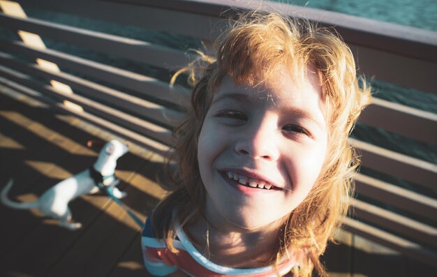 Funny smile Closeup Kids Face Child with Puppy Dog Wide angle