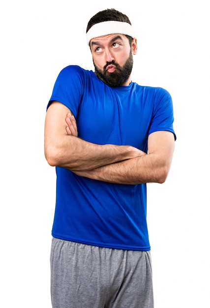 Funny sportsman making unimportant gesture on isolated white background