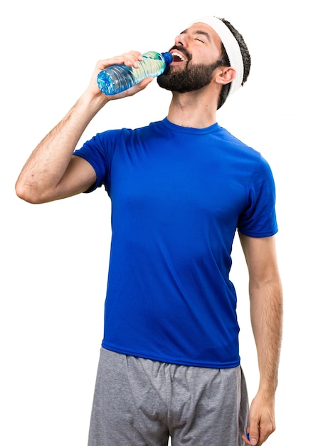 Funny sportsman with a bottle of water on isolated white background