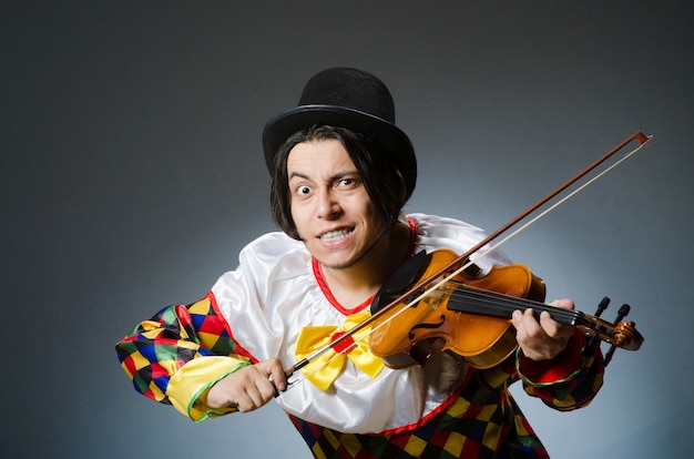 Funny violin clown player