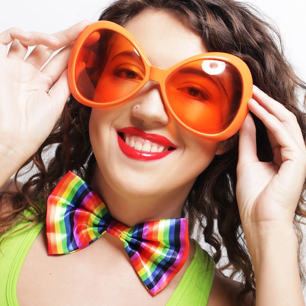 Funny woman wearing big bright sunglasses