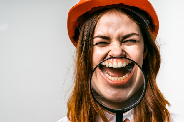 Photo funny woman with magnifier smiling,dental problems,zoom