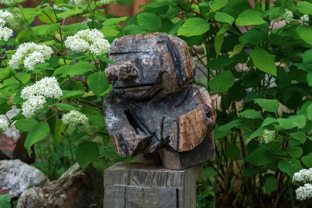 funny wooden garden figurine carelessly carved