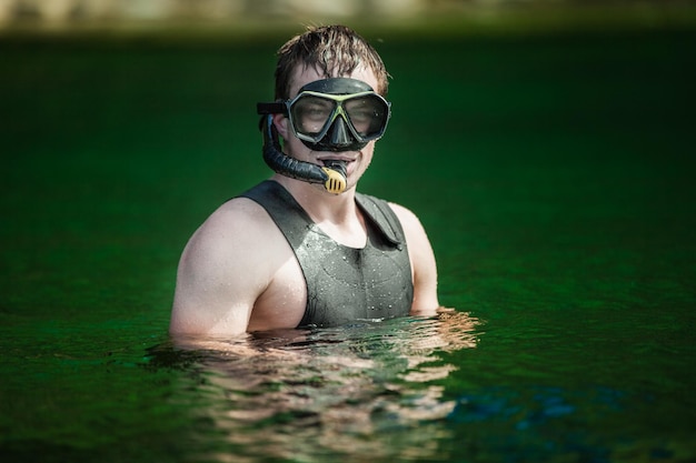 Funny Young Adult Snorkeling in a river