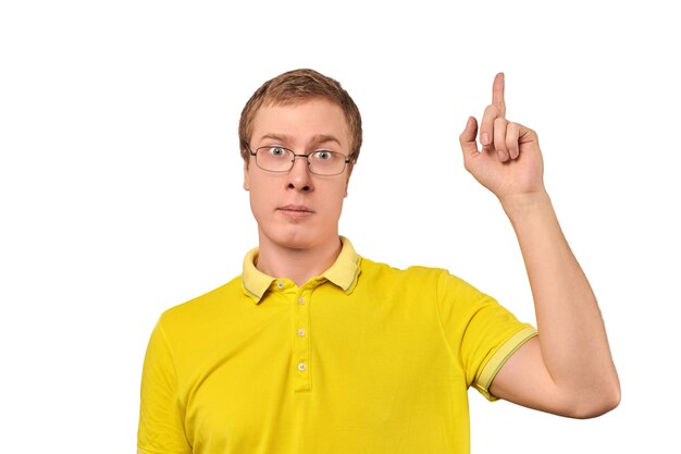 Funny young guy in corrective glasses and yellow Tshirt with eureka gesture man got idea isolated