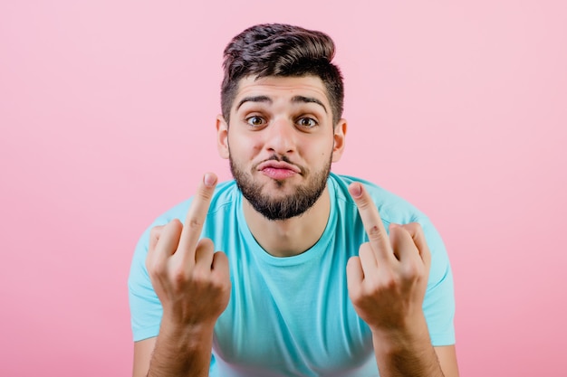 Funny young middle eastern guy showing middle finger