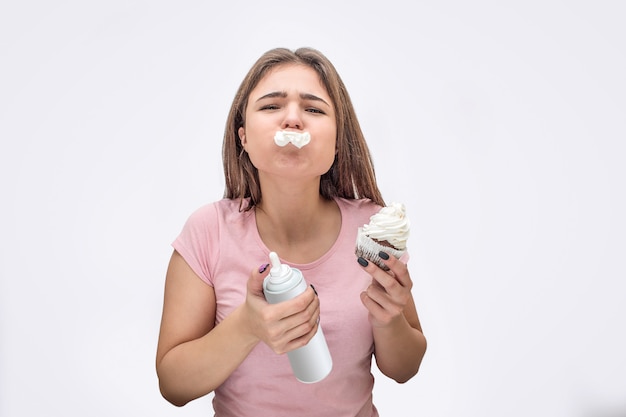 Funny young woman put some cream between mouth and nose