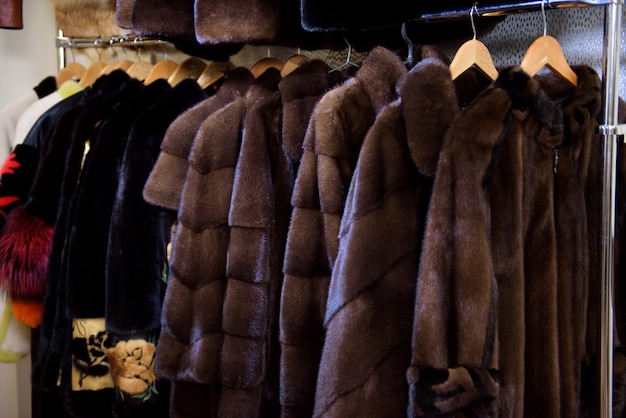 Fur coats made for ladies and exposed for sale.