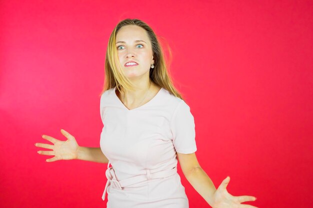 Furious blonde young woman looking at camera