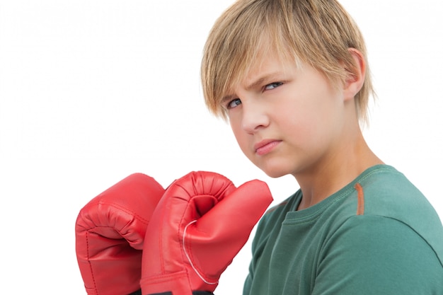 Furious boy with boxing gloves 