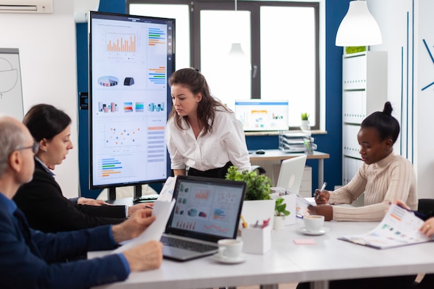 Furious woman screaming at company office boardroom meeting having disagreement controversy