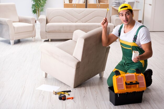 Furniture repairman repairing armchair at home