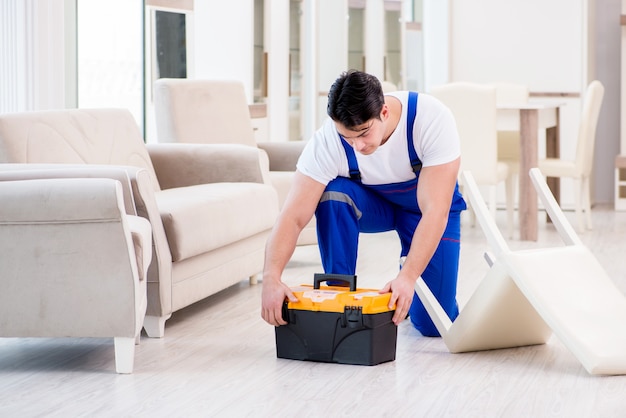 Furniture repairman working in store