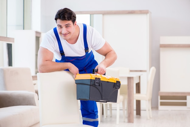 Furniture repairman working in store