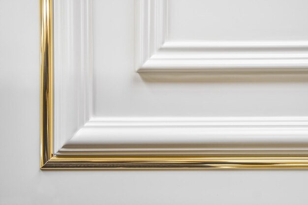 Furniture white facade panel with molding decorative strip in classical style extreme closeup