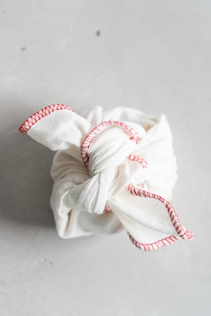 Furoshiki - Asian technique of wrapping tying items for gift, easy carrying. 