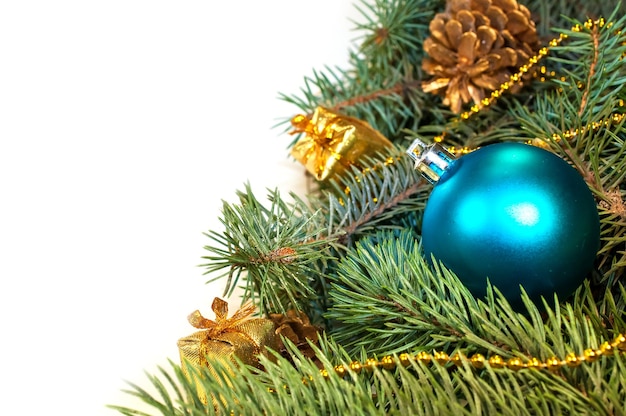 Furry Christmas tree branches with cones gifts and toys on a white background