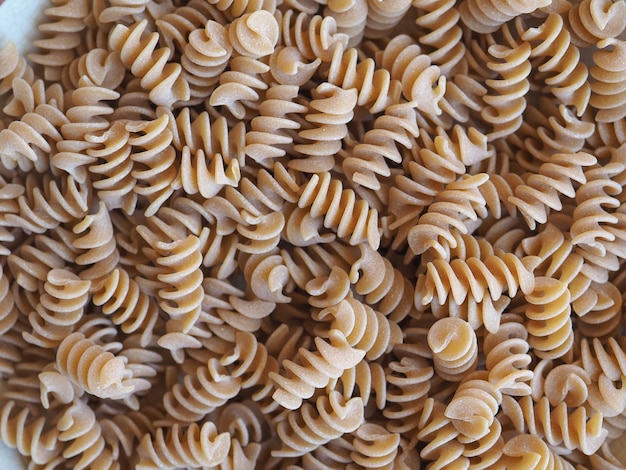 Fusilli Italian pasta background