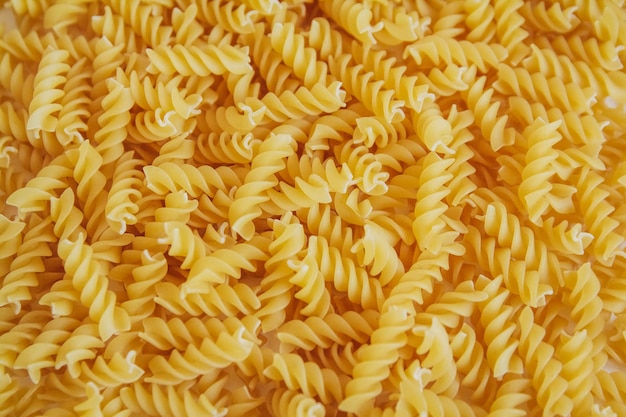 Fusilli pasta as background image Image texture spiral macaroni