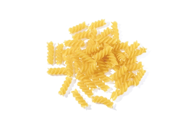 Fusilli pasta isolated on white background. Heap of uncooked dried fusilli, traditional Italian cuisine. Top view.