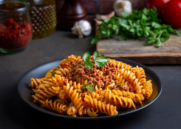 Fusilli pasta spiral or spirali pasta with tomato minced sauce Italian food style