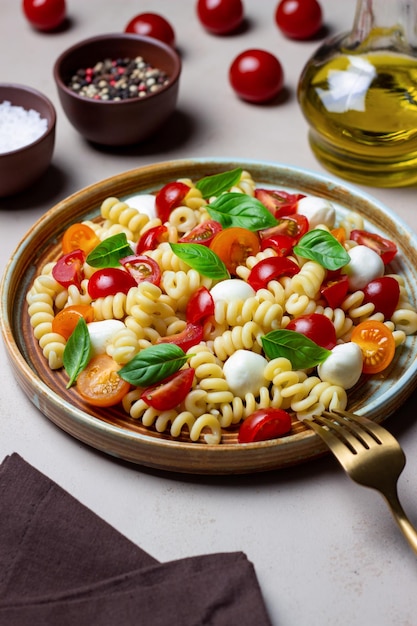 Fusilli pasta with mozzarella tomatoes and basil Italian food Healthy eating Vegetarian food