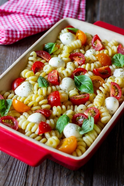 Fusilli pasta with mozzarella tomatoes and basil italian food\
healthy eating vegetarian food