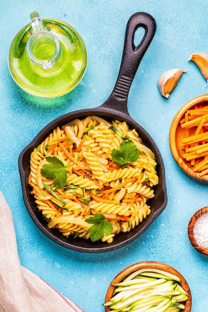 Fusilli pasta with squid, zucchini and carrots